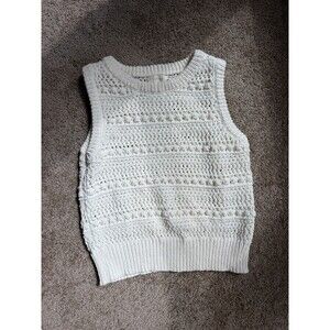 Greige white/ivory sleeveless crochet knit sweater vest featuring an open-knit